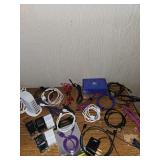 Collection of charging cables, blocks and tabletop charger.