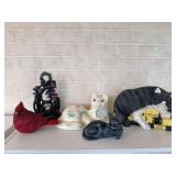 Two decorative door stops, including a painted cast iron English Fox Hunt theme, and a painted cast iron cat, two cat sculptures, and a cardinal sculpture