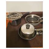 Pots and pans, various brands and sizes.