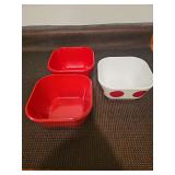 Free square plastic bowls. Two red, one white with red polka dots.