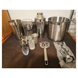Bar tools. Ice bucket, cocktail shakers, corkscrew and shot glasses.