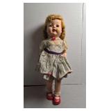 Vintage hard plastic doll with movable head and arms, walking action legs.