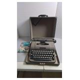 Retro Underwood typewriter in case with original instruction manual.