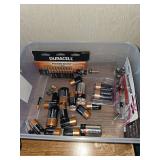 Tote of miscellaneous batteries.