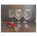 Five wine glasses and corkscrew