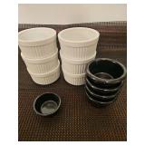 Six small white fluted ceramic ramekins, four black, one smaller black dipping sauce ramekins.