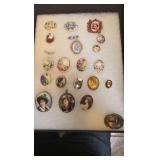 Collection of porcelain broches and pins