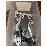Bin of power strips and surge protectors