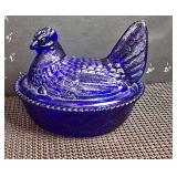 Vintage Westmoreland cobalt blue glass hen on a nest covered dish.