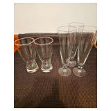 Five Pilsner glasses. Two 6.5in tall and three 8.5in tall