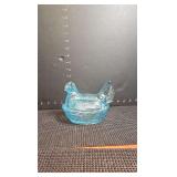 Aqua blue glass covered hen with split tail on nest dish.