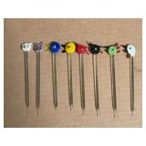 Set of eight glass cocktail picks