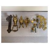 Miscellaneous Brass Home Decor Pieces, Including a Wall Hook, Three Door Knockers, Cabinet/Drawer Pulls, and Curtain Holdbacks