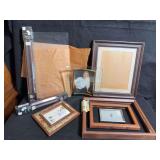 Assorted picture frames, including one piece of cut class and wood frame pieces