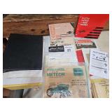 Collection of various brands of tractor and vehicle manuals