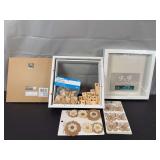 Pair of 9”x9” White Wood Framed Shadowboxes, with collection of wooden and fabric embellishments