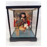vintage Japanese samurai doll (10”) that appears to represent the legendary figure Kintaro, in a glass display case