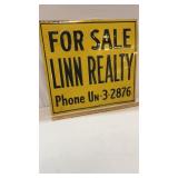 Old Embossed Tin Linn Realty Sign