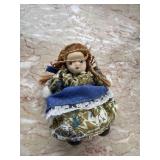 Vintage miniature porcelain-head souvenir doll