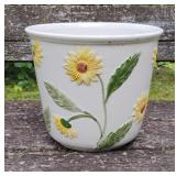 Pot with raised sunflowers