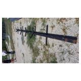 Black metal roller appr 17 feet long