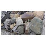 2 small piles of large stone on broken skids