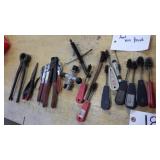 small wire brushes, livestock nipper, pliers