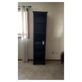 Tall open shelf with contents