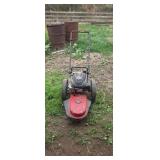 Walk behind string mower. Engine turns over