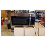 Microwave over the range. Appears new and works