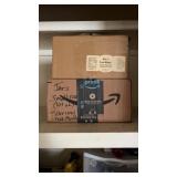 Canning jars in boxes and canning pot with