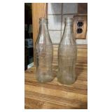 Two 10oz coke bottles