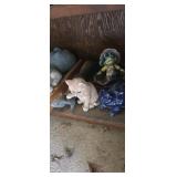 Yard decor contents of shelf