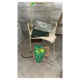 Chairs and concrete bench with frogs