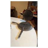 Cast iron waffle maker, cherry pitter and wall
