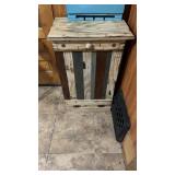 Tilt out trash cabinet