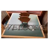 Welcome sign and pig napkin holder