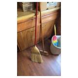 Brooms, duster and garbage can