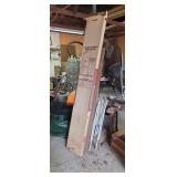 Bifold doors, plywood and lawn chairs