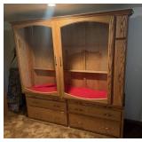 Gun cabinet holds 26 long guns. It is currently