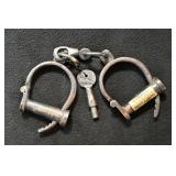 Hinged Handcuffs with key.  Has Property of Alcatr