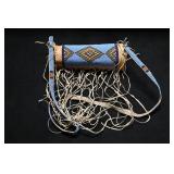 Beaded Parfleche Cylinder with Straps.