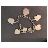SILVER TONE CHARM BRACELET W/PROFILE CHARMS