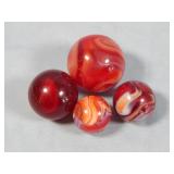(4) Assorted Vintage Red Slag Marbles
