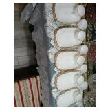 9 milk glass snack sets with gold trim.