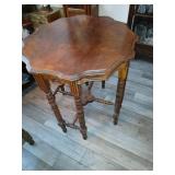 Walnut parlor table 29 x 30 inches tall 8 legs