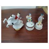 3 clown music boxes, one is animated.
