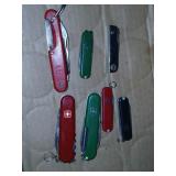 7 pocket Knives, Swiss army and more.