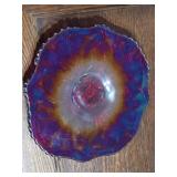 Red Carnival glass platter, 13 inches wide.