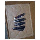4 pocket knives.